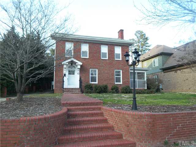 912 West Johnson Street Raleigh, NC 27605 - Photo 1 of 12 a front view of a house with a yard and trees