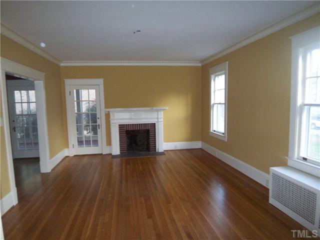 912 West Johnson Street Raleigh, NC 27605 - Photo 3 of 12 a view of an empty room with wooden floor and a window