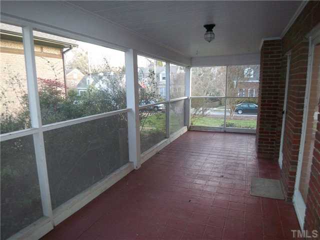 912 West Johnson Street Raleigh, NC 27605 - Photo 7 of 12 a view of empty room with wooden floor and floor to ceiling window