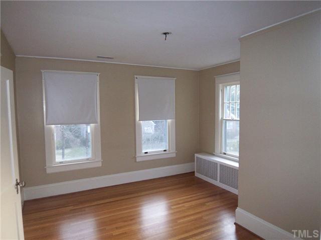 912 West Johnson Street Raleigh, NC 27605 - Photo 10 of 12 a view of an empty room with wooden floor and a window