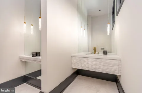 a spacious bedroom with a bed and a large window