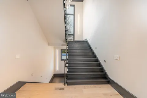 a view of a hallway with washer and dryer