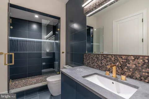 a bathroom with a bathtub and shower