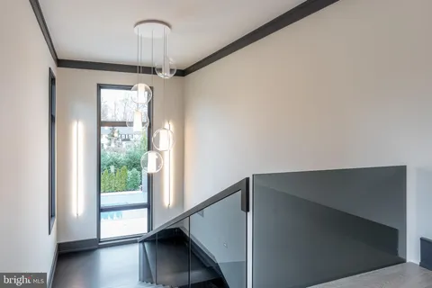 a living room with fireplace furniture and a potted plant