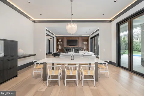 a large kitchen with a table and chairs in it