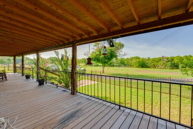 a view of balcony with wooden floor