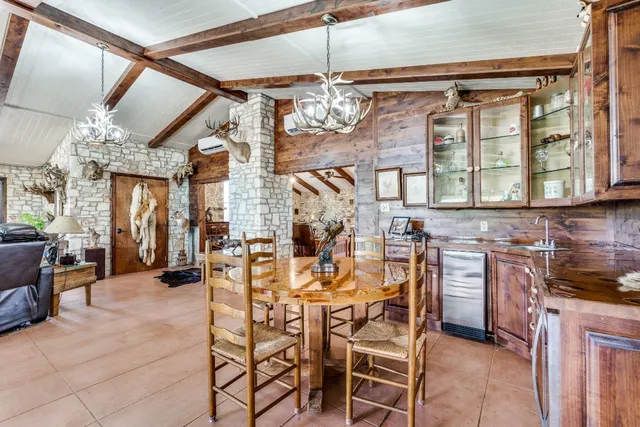 a living room with fireplace furniture and a flat screen tv