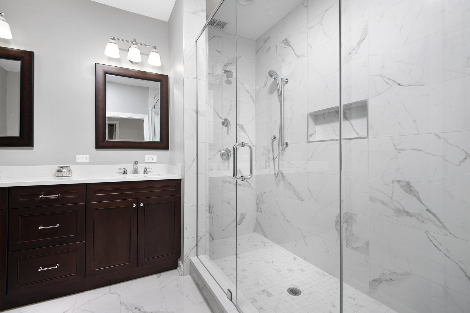 2918 North Racine Avenue Chicago, IL 60657 - Photo 14 of 26 a bathroom with a double vanity sink mirror and shower