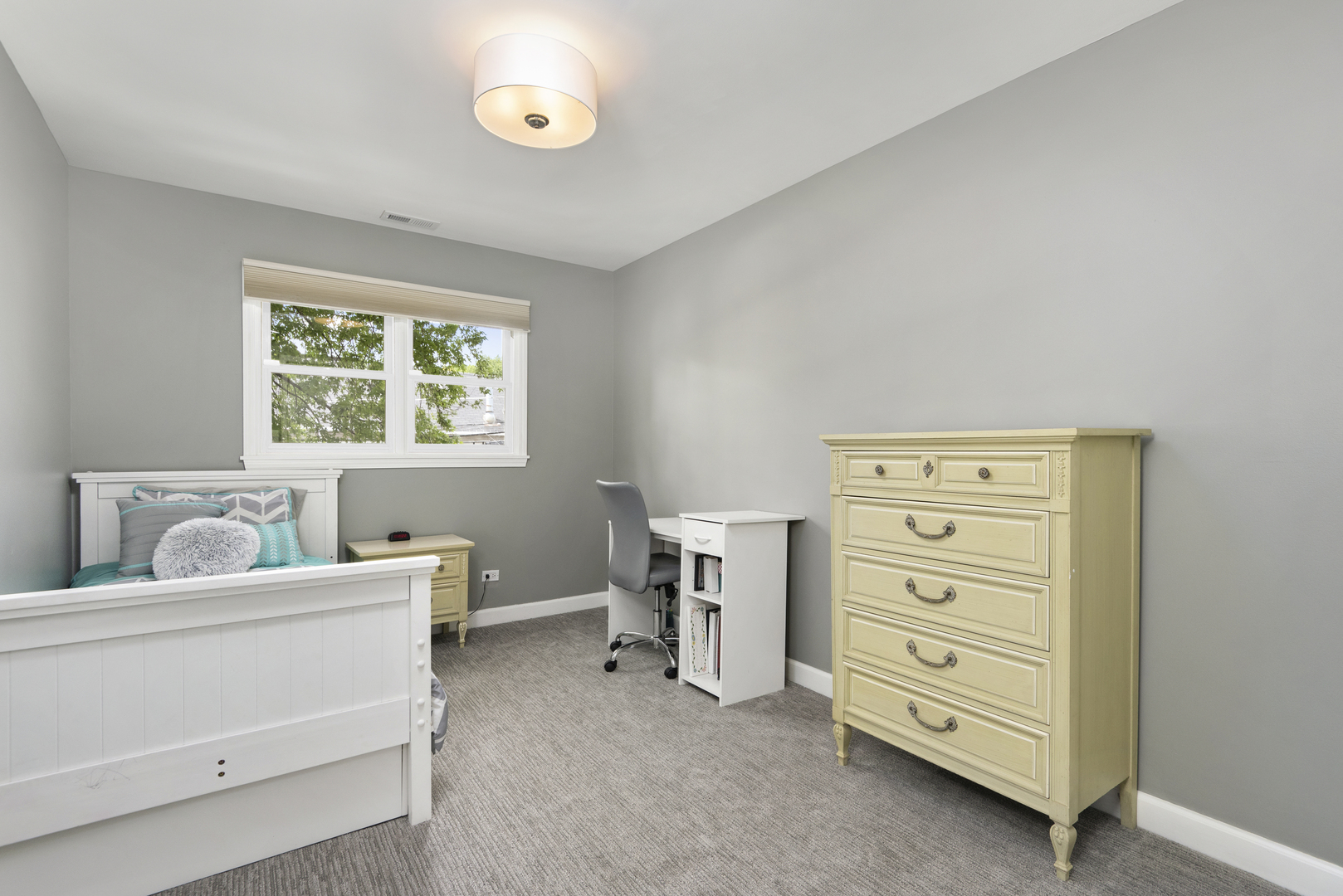 2918 North Racine Avenue Chicago, IL 60657 - Photo 15 of 26 a room with a dresser and a window