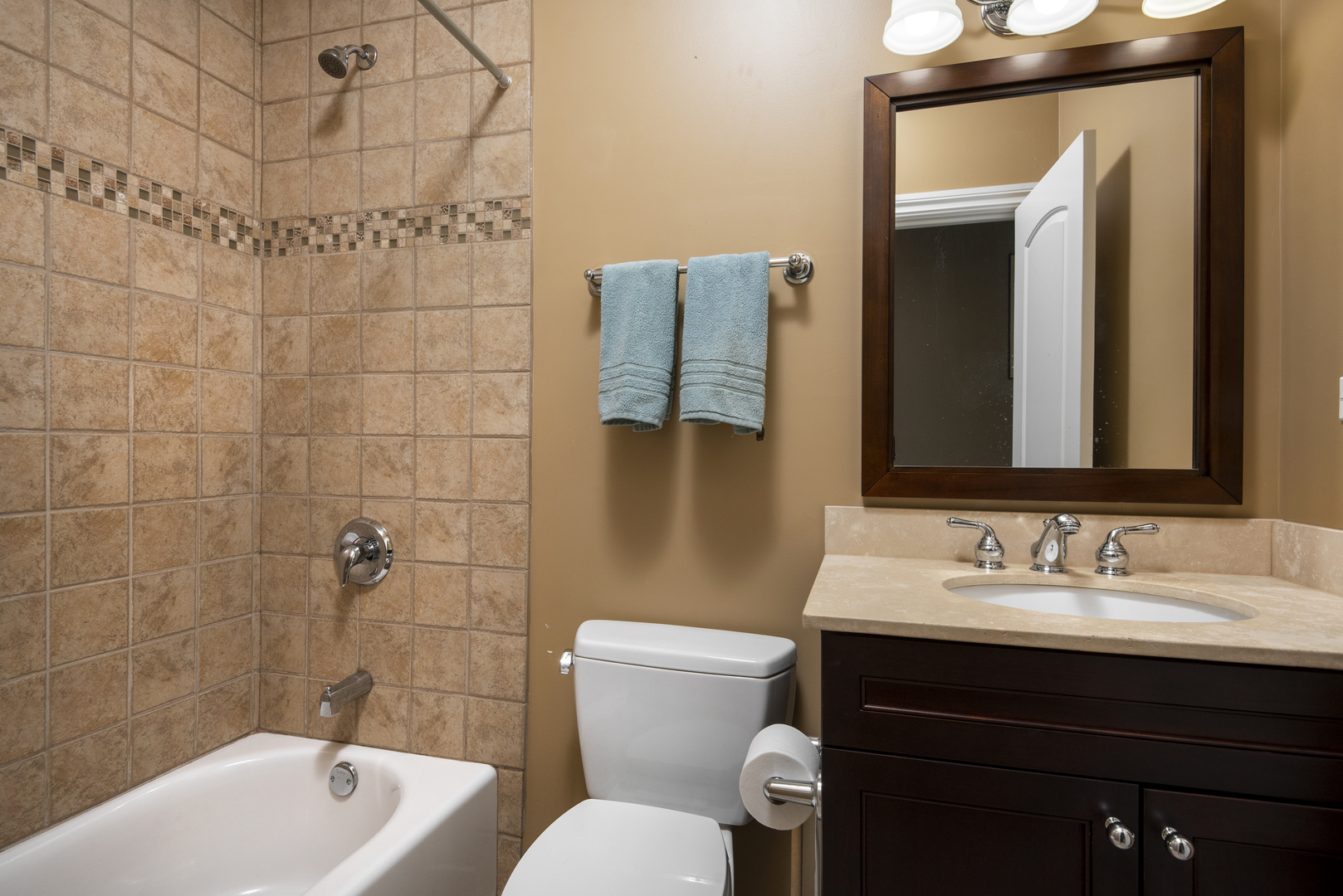 2918 North Racine Avenue Chicago, IL 60657 - Photo 21 of 26 a bathroom with a sink and a mirror