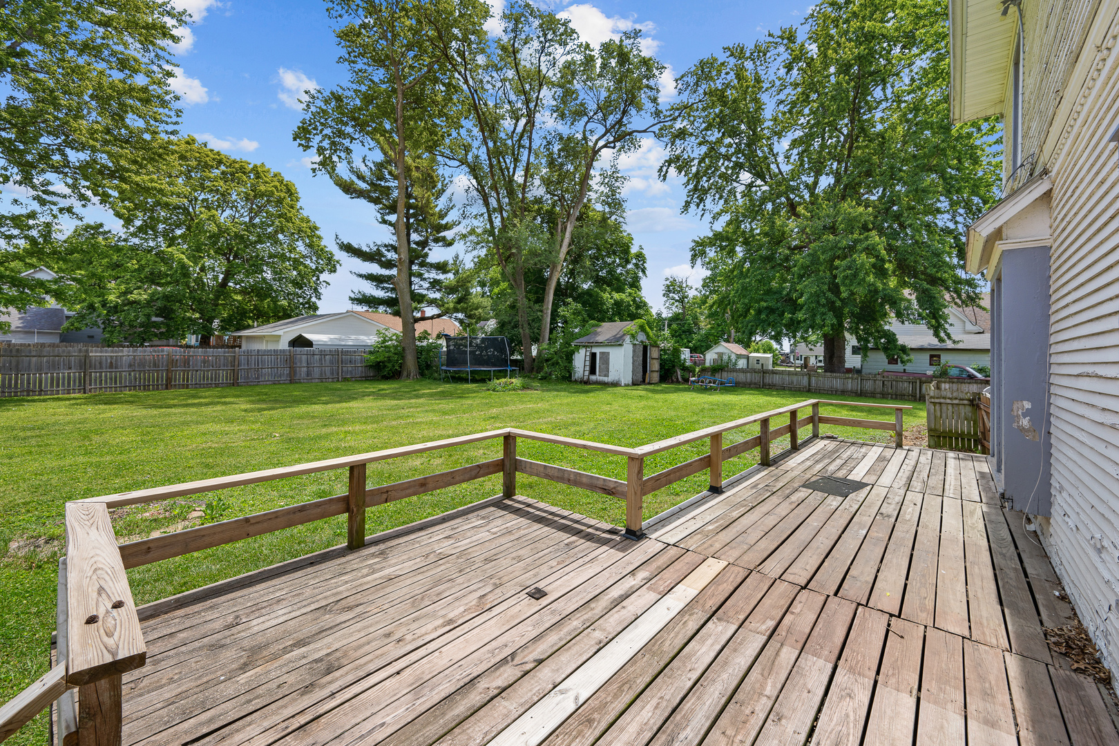 1202 20th Avenue Viola, IL 61486 - Photo 8 of 50 a view of a wooden deck with a yard