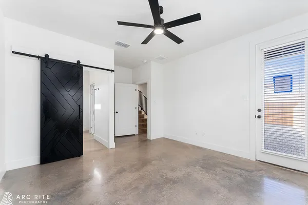 a view of an empty room with a window