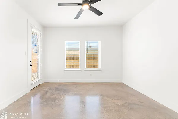 a spacious bathroom with double vanity and a mirror