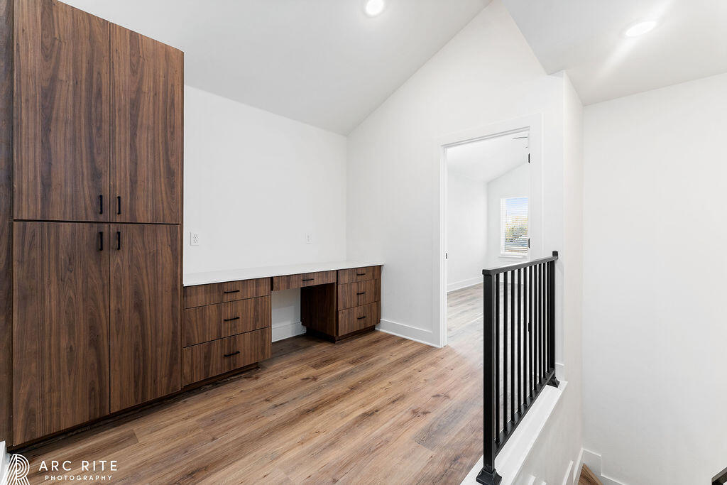4509 22nd Place Lubbock, TX 79407 - Photo 19 of 32 a view of a hallway with wooden floor and cabinet