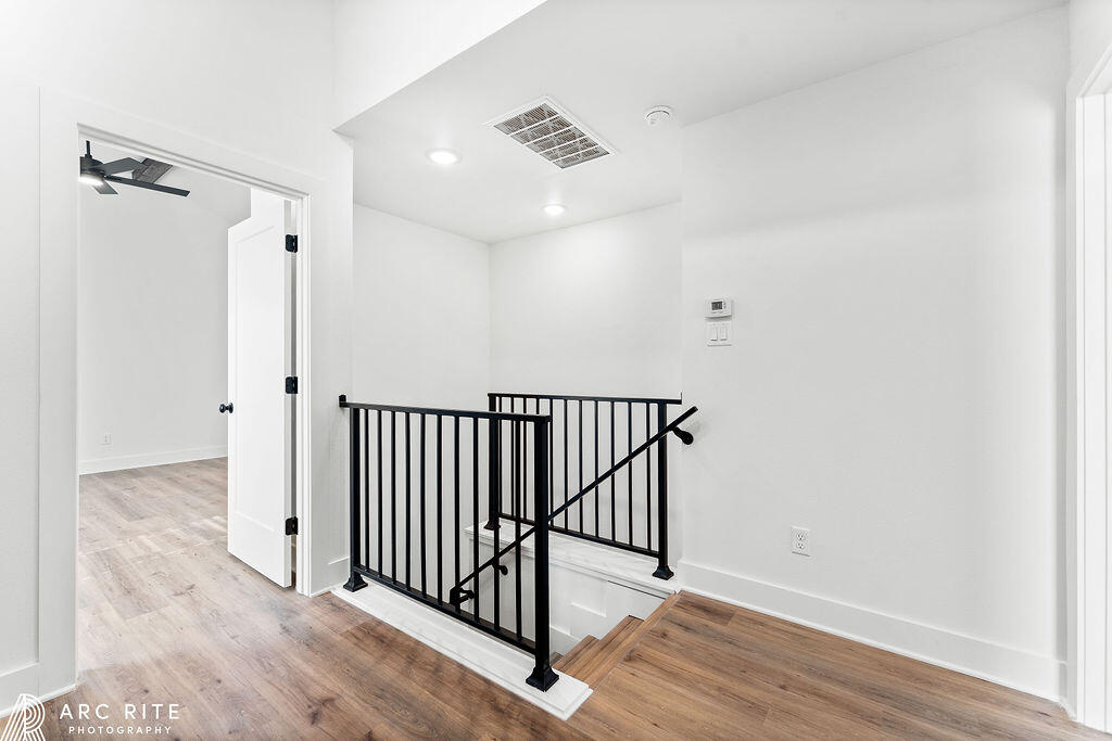 4509 22nd Place Lubbock, TX 79407 - Photo 20 of 32 a view of a hallway with wooden floor