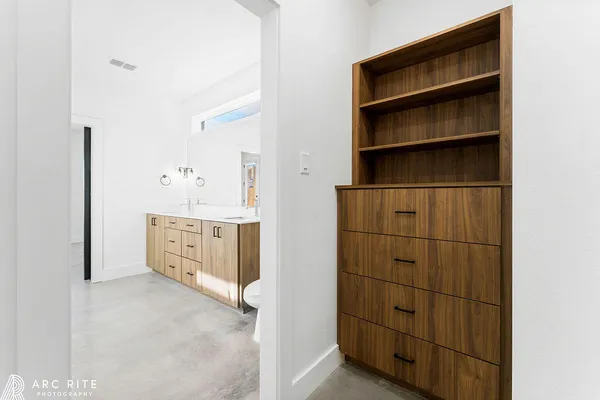 a bathroom with a toilet a sink and a mirror