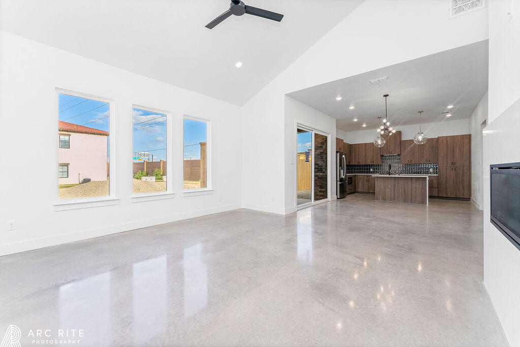 4509 22nd Place Lubbock, TX 79407 - Photo 4 of 32 a view of a kitchen with a sink and cabinets