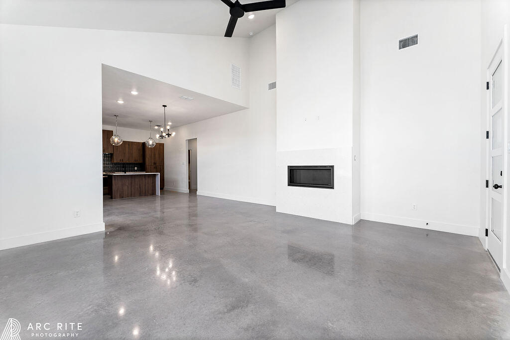 4509 22nd Place Lubbock, TX 79407 - Photo 5 of 32 a view of a livingroom with a fireplace