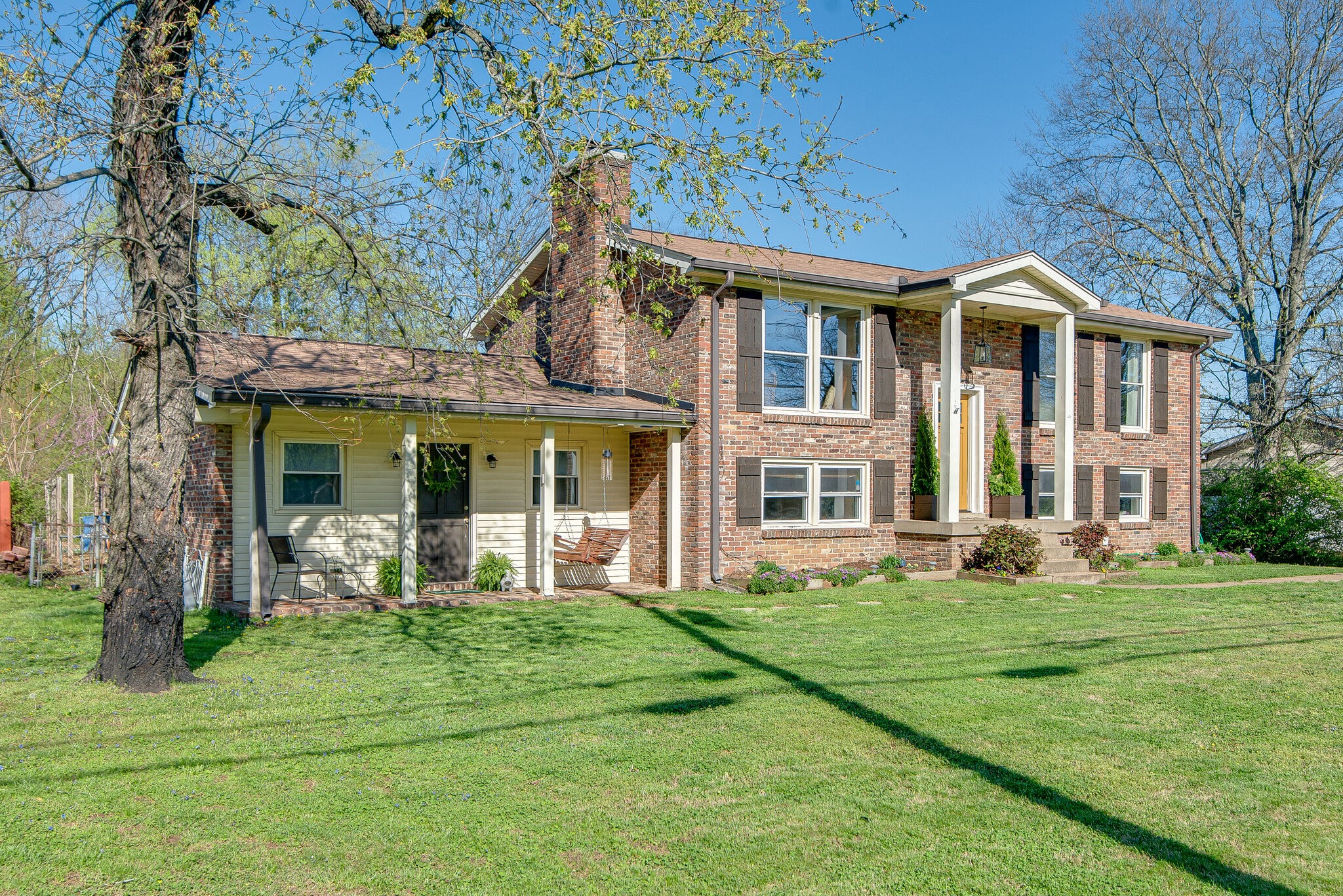 1225 Neelys Bend Road Madison, TN 37115 - Photo 1 of 32 a front view of a house with a yard