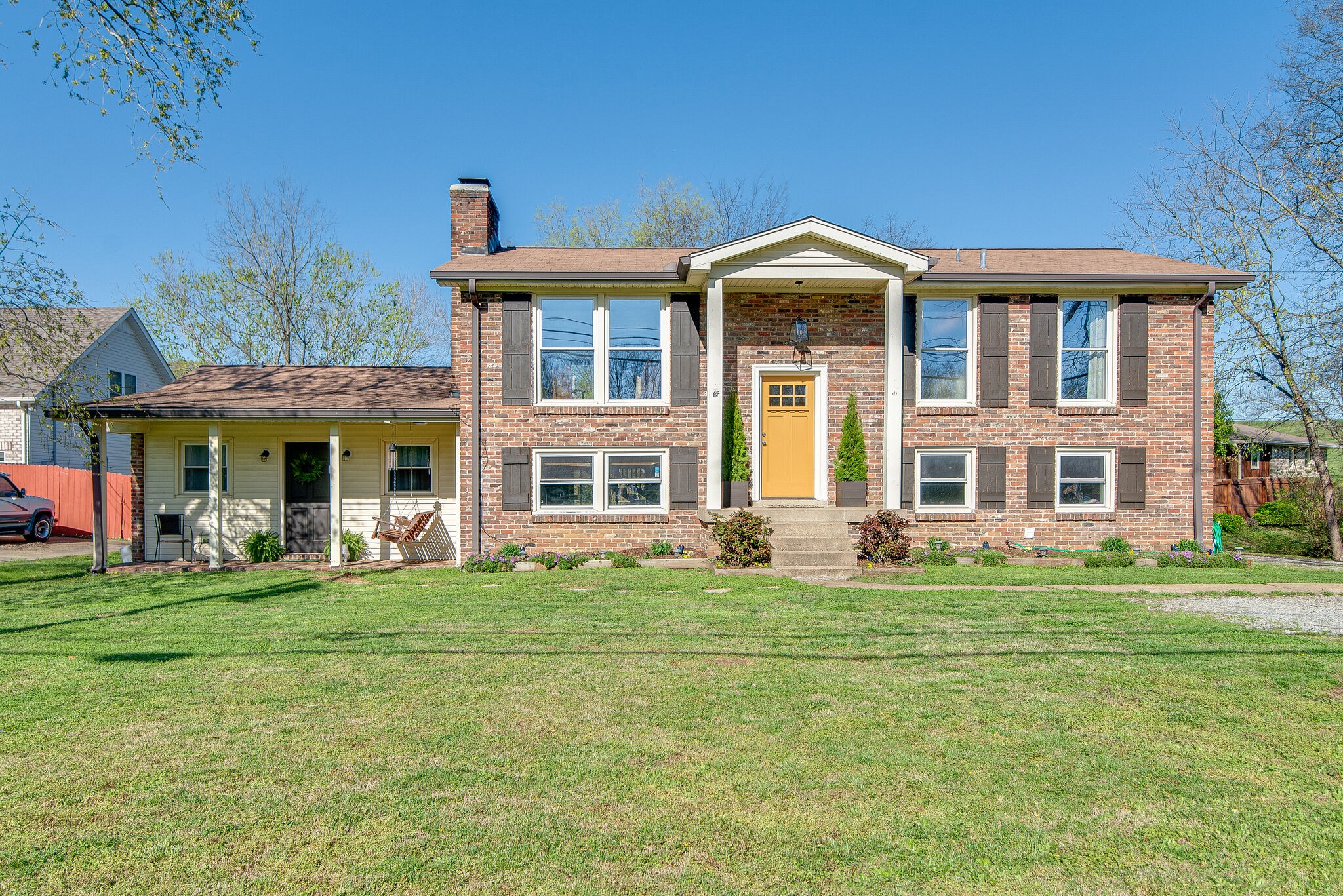 1225 Neelys Bend Road Madison, TN 37115 - Photo 2 of 32 a front view of a building and that has big trees