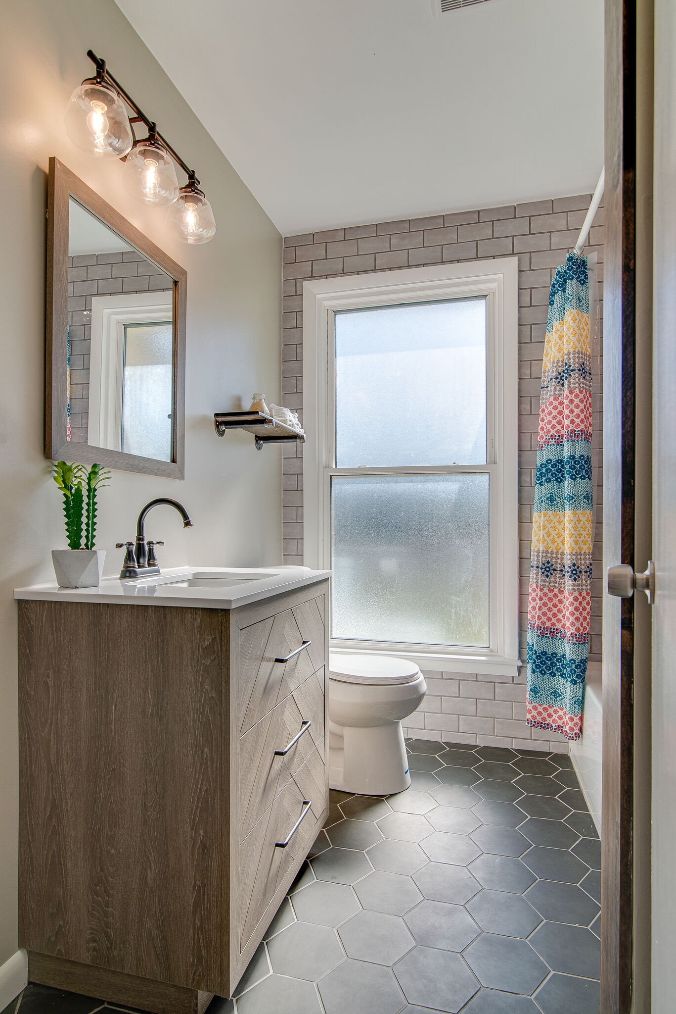 1225 Neelys Bend Road Madison, TN 37115 - Photo 16 of 32 a bathroom with a sink toilet and shower