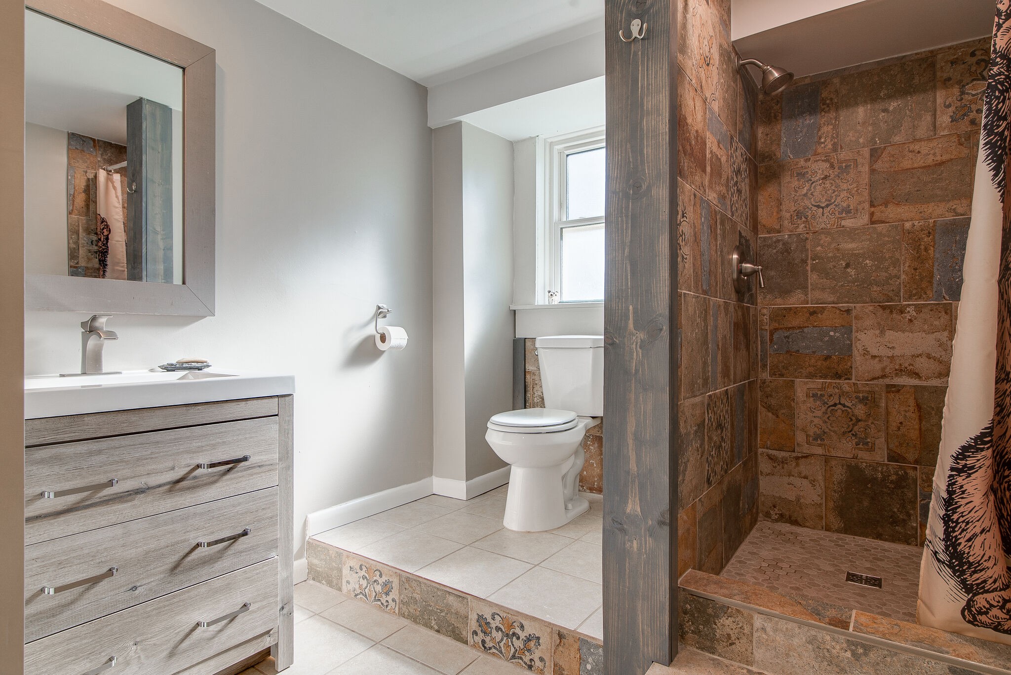 1225 Neelys Bend Road Madison, TN 37115 - Photo 22 of 32 a bathroom with a shower a sink and toilet