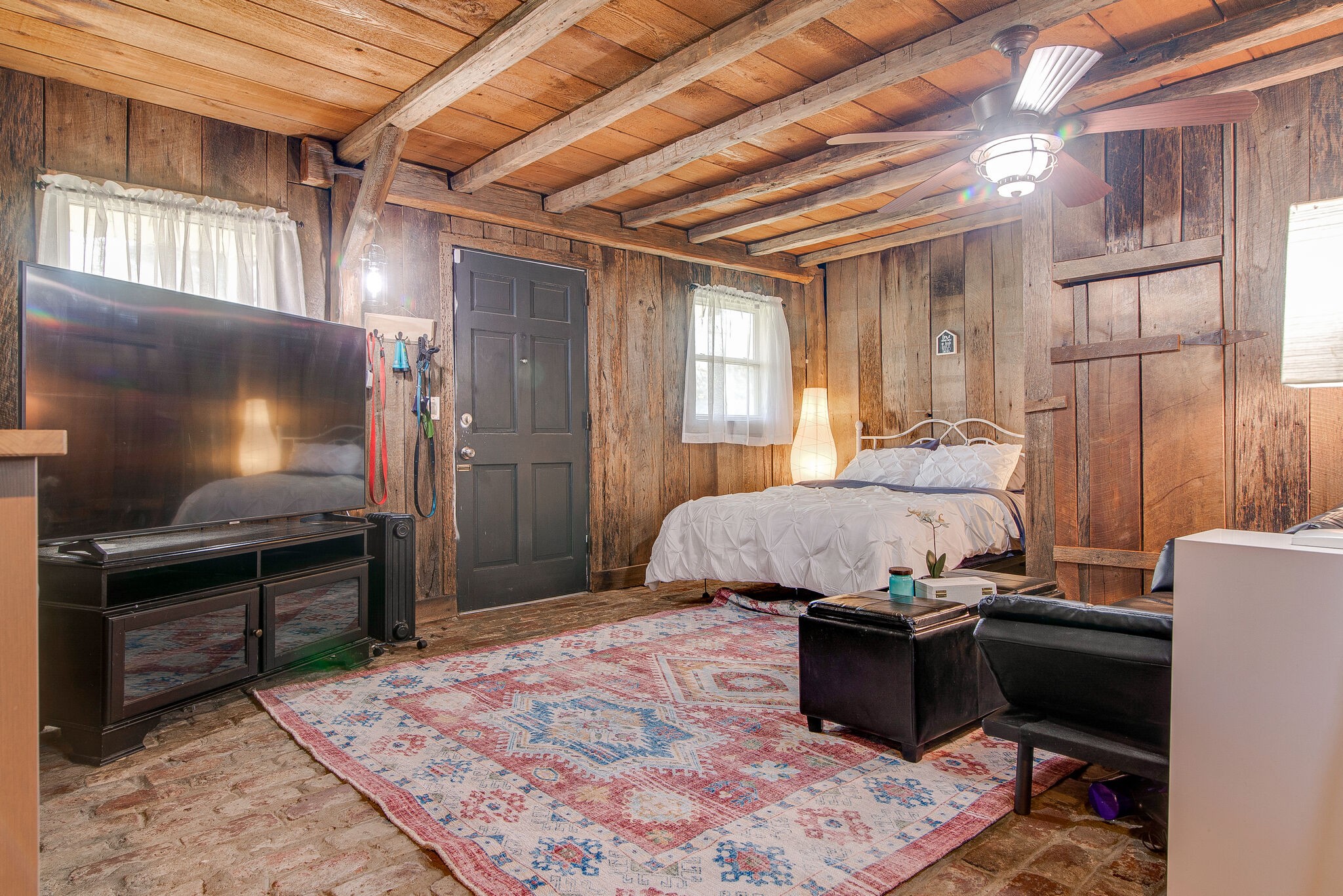 1225 Neelys Bend Road Madison, TN 37115 - Photo 25 of 32 a bedroom with a bed and a television