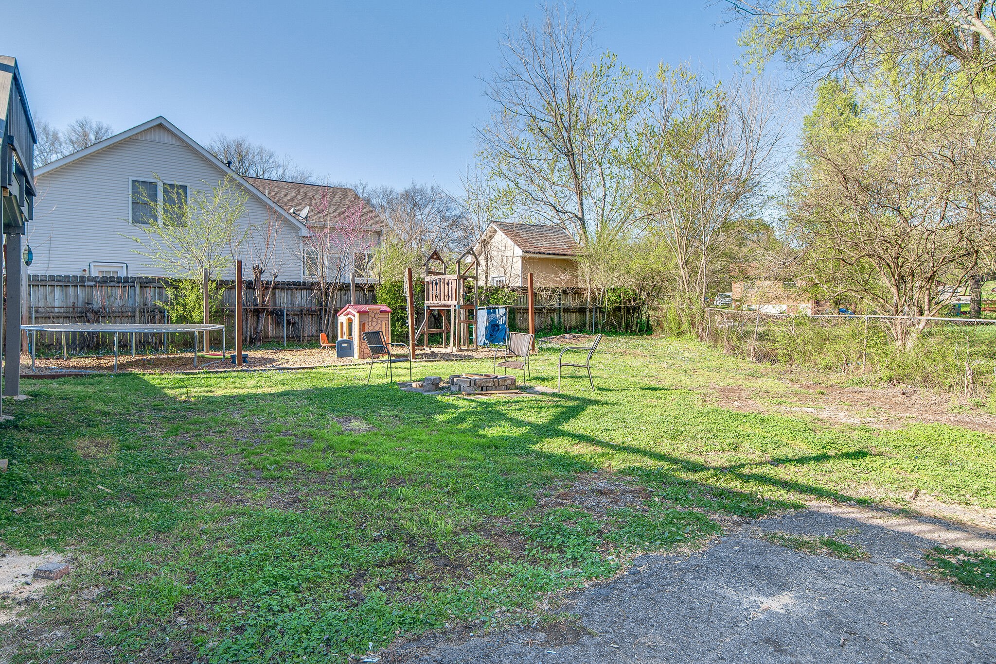1225 Neelys Bend Road Madison, TN 37115 - Photo 32 of 32 a view of a house with a big yard and large trees