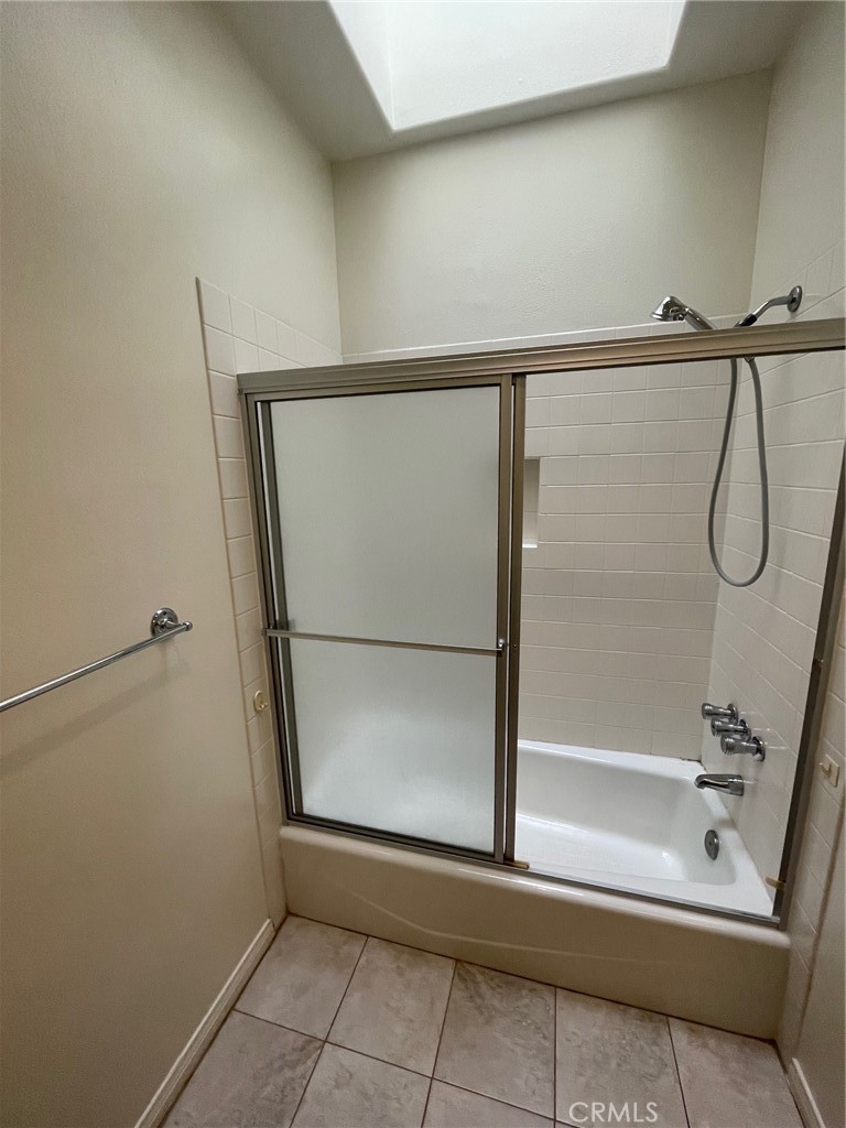 10010 Reseda Boulevard, Unit D Northridge, CA 91324 - Photo 11 of 22 a bathroom with a glass shower door