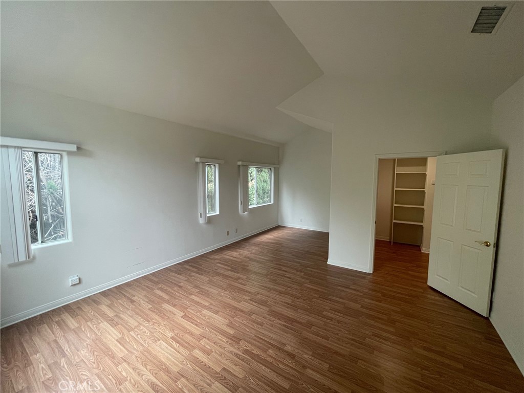 10010 Reseda Boulevard, Unit D Northridge, CA 91324 - Photo 14 of 22 wooden floor in an empty room with a window