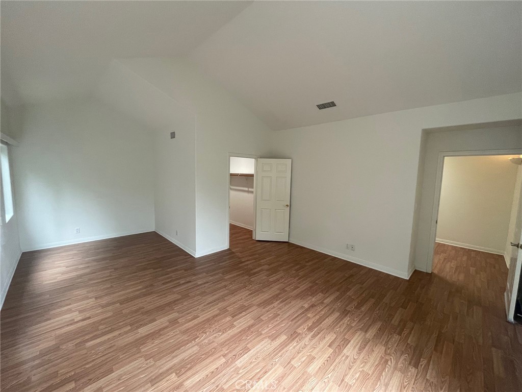 10010 Reseda Boulevard, Unit D Northridge, CA 91324 - Photo 17 of 22 a view of empty room with wooden floor