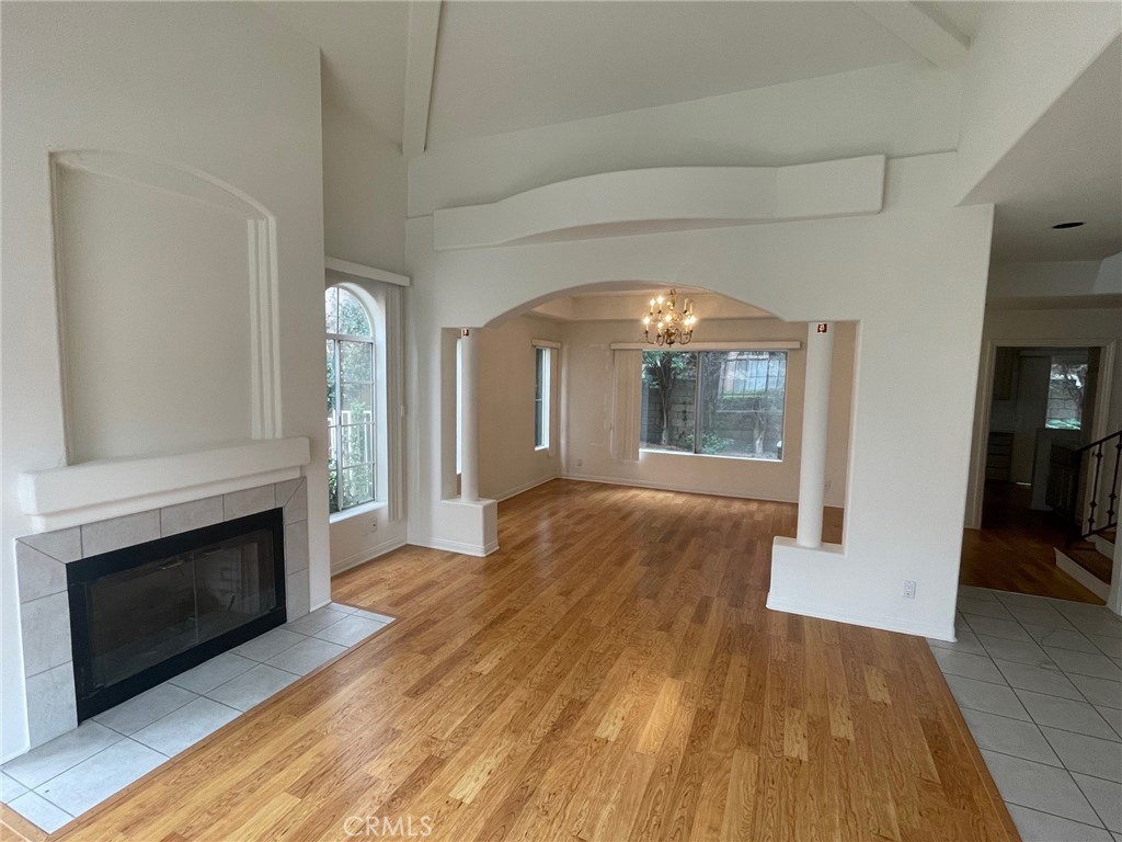 10010 Reseda Boulevard, Unit D Northridge, CA 91324 - Photo 2 of 22 a view of empty room with wooden floor and fireplace