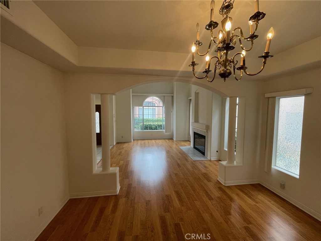 10010 Reseda Boulevard, Unit D Northridge, CA 91324 - Photo 6 of 22 a view of a room with wooden floor fireplace and windows