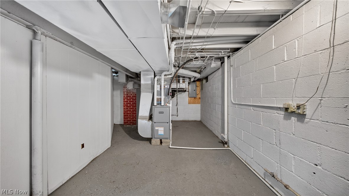16811 Invermere Avenue Cleveland, OH 44128 - Photo 46 of 47 Unfinished basement with heating unit and electric panel