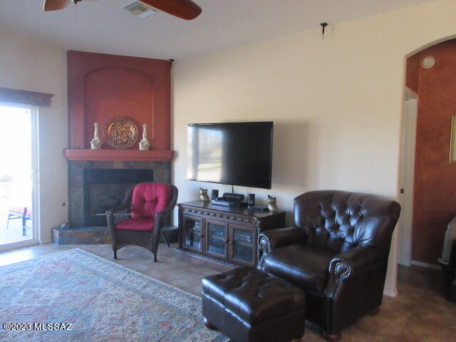 511 Camino Hombre De Oro Rio Rico, AZ 85648 - Photo 32 of 44 a living room with furniture and a flat screen tv