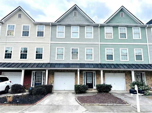 a front view of a house with entryway and a yard