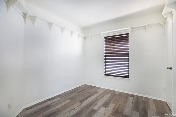 a view of a room that has a window in it