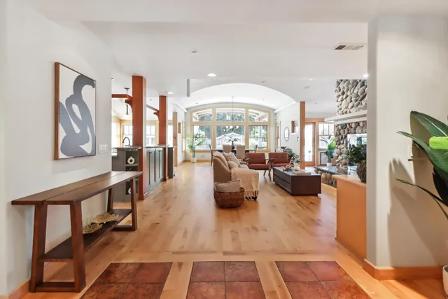 a large kitchen with stainless steel appliances granite countertop lots of counter space and a sink