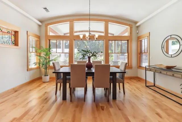 a living room with furniture a table and a fireplace