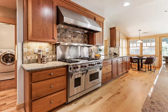 a room with a large window and a bed