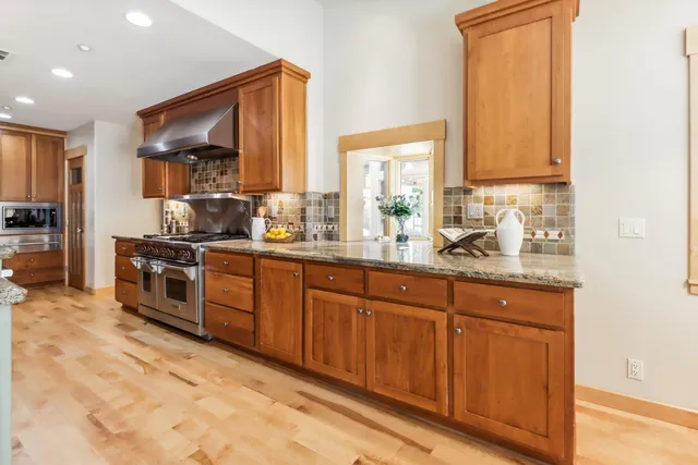 a bathroom with a sink a mirror and a shower