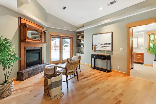 a view of a patio with a table chairs and a backyard