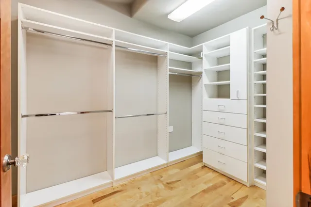 a view of a room with wooden walls