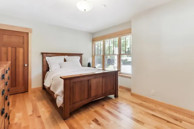 a view of a room that has a bed in it