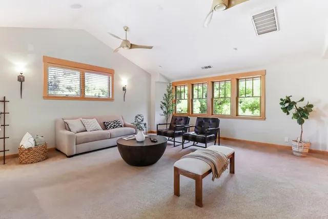 an aerial view of multiple houses with yard