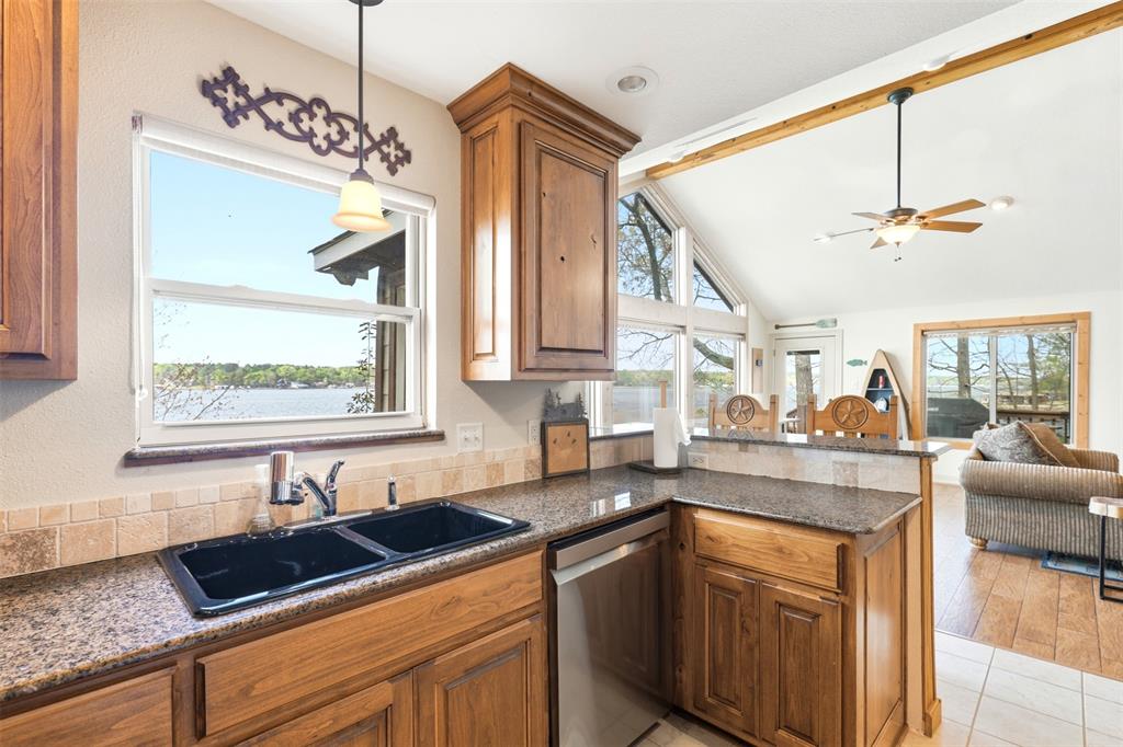307 South Park Road Scroggins, TX 75480 - Photo 15 of 33 a kitchen with a sink stove and cabinets