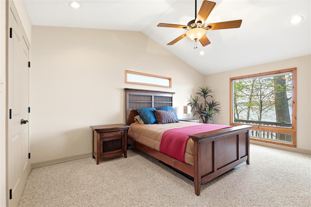 307 South Park Road Scroggins, TX 75480 - Photo 16 of 33 a bed room with a bed and a ceiling fan