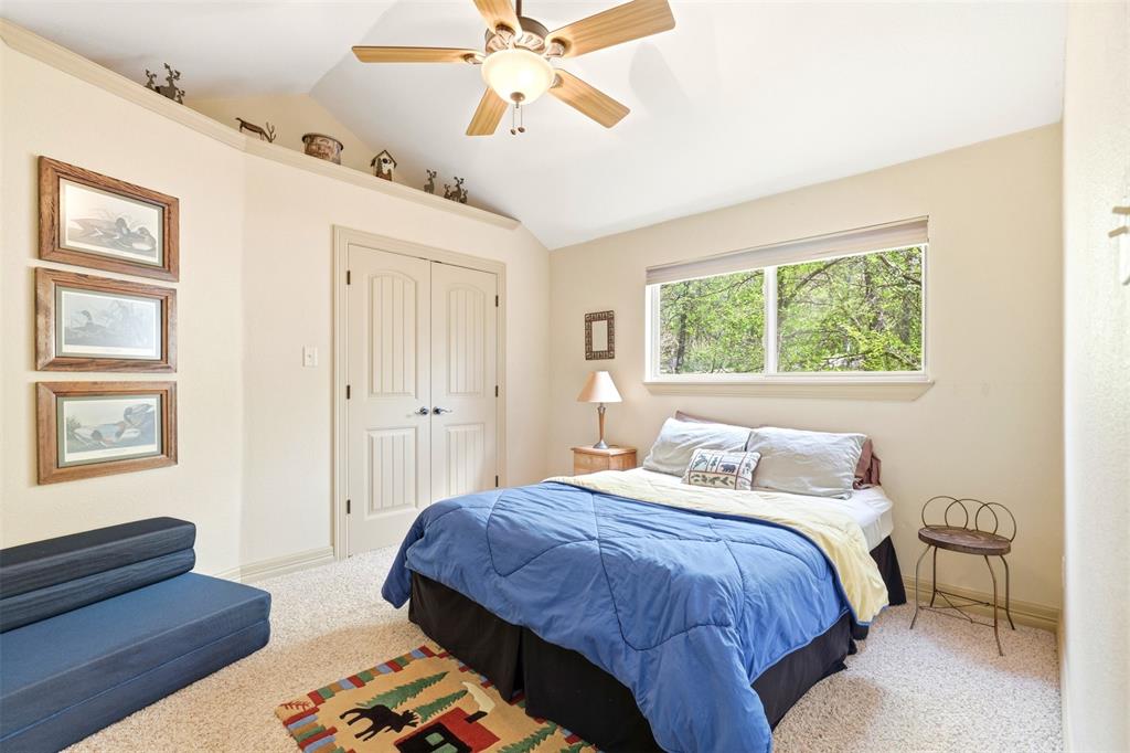 307 South Park Road Scroggins, TX 75480 - Photo 20 of 33 a bedroom with a bed and wooden floor