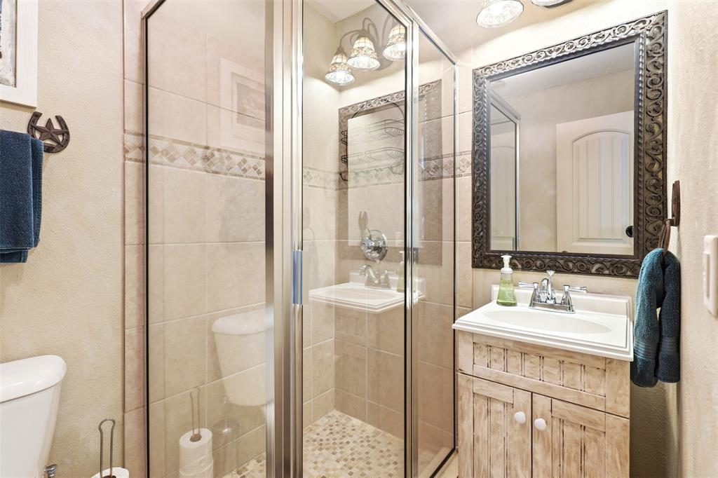 307 South Park Road Scroggins, TX 75480 - Photo 21 of 33 a bathroom with a sink a toilet and shower