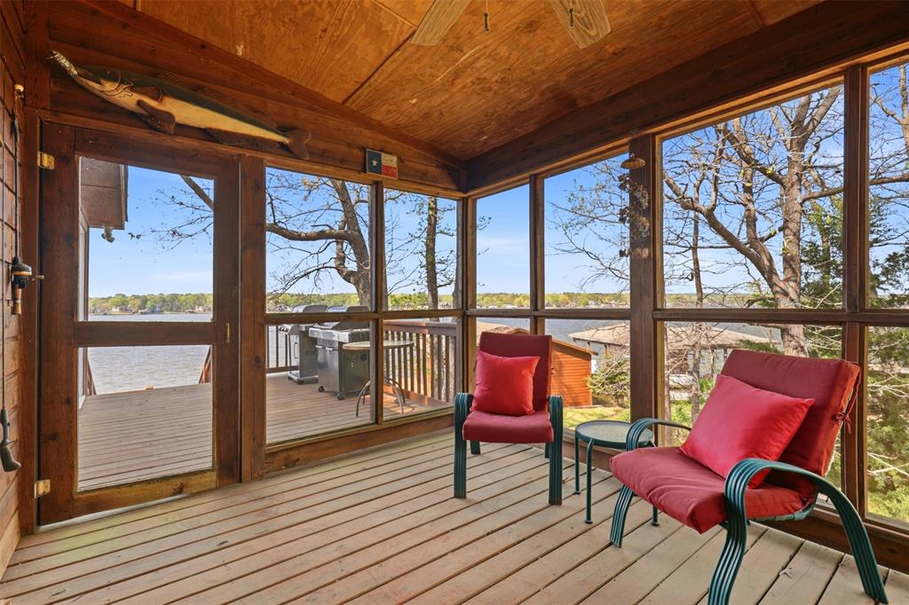 307 South Park Road Scroggins, TX 75480 - Photo 23 of 33 a balcony with chairs and wooden floor